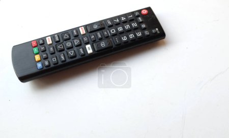 Photo for Remote control tv isolate on a white paper color for background.concept of watching tv.top view with place for text. - Royalty Free Image