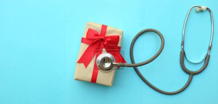 Photo for Medical stethoscope with gift box isolated on a blue pastel background. concept christmas and new year.horizontal photo - Royalty Free Image