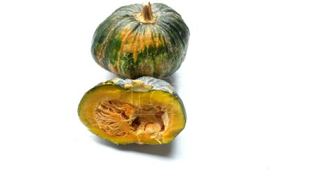 A pile of fresh raw green Japanese pumpkin (Cucurbita moschata) ,Kabocha squash,isolated on a white backdrop.Healthy food vegetable, fruit, and food business idea