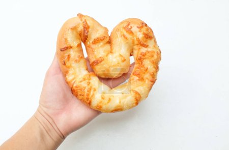 Bacon and Mayonnaise Topped on Heart Shaped Bread  in a  hand woman asian  Isolated on a White Backdrop