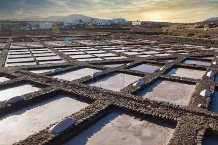 Photo for Traditional methods of sea salt production. Salinas del Carmen, Fuerteventura, Canary Islands, Spain - Royalty Free Image