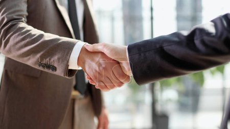 Photo for Successful business people handshaking after good deal. - Royalty Free Image