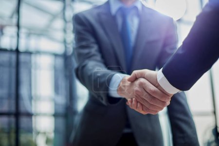 Foto de Two diverse professional business men executive leaders shaking hands at office meeting - Imagen libre de derechos