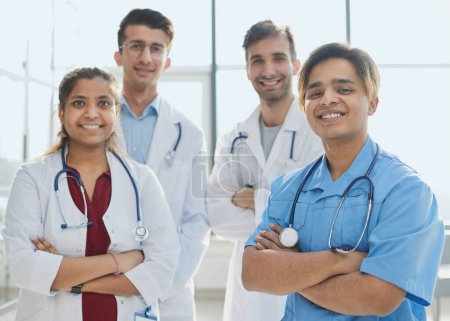 Photo for Professional Multinational Doctors Camera Posing. Teamwork Connection. - Royalty Free Image