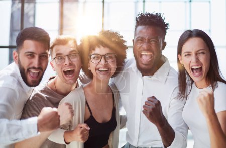 Photo for Portrait of successful creative business team looking at camera and smiling. Diverse business people standing together at startup. - Royalty Free Image