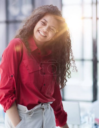 Photo for Image of young beautiful joyful woman smiling while working with laptop in office - Royalty Free Image