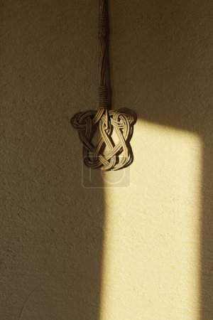 oriental carpet beater hanging on clay wall. 3D rendering