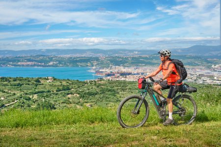 Photo for Nice active woman on a mountain bike tour at the Slovenian Mediterranen cost above Koper - Royalty Free Image