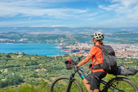 Photo for Nice active woman on a mountain bike tour at the Slovenian Mediterranen cost above Koper - Royalty Free Image