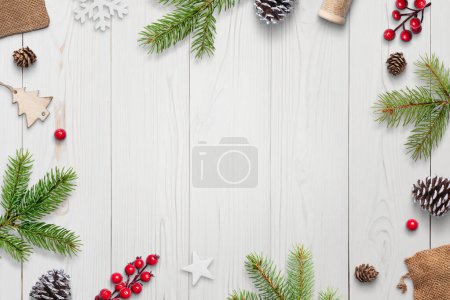 Photo for Top view of festive white wooden desk with Christmas decorations, gifts, and copy space. Elegant holiday composition - Royalty Free Image