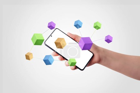 Hand holding smartphone with blockchain cubes, binary code, and connecting lines. Illustrates digital connectivity and blockchain technology. Perfect for tech and finance