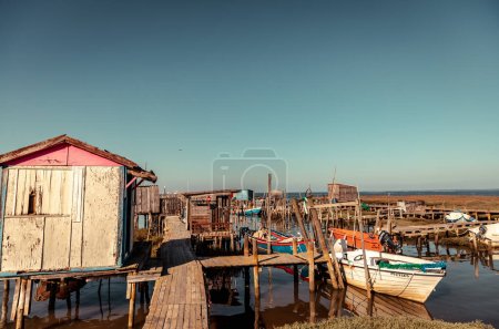 Wooden walkways and huts of the Cais de Palafitas da Carrasqueira.,Palafitico da Carrasqueira Pier in  Comporta Portugal