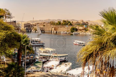 Photo for Nile river landscape with sightseeing boats at the philae  temples - Royalty Free Image