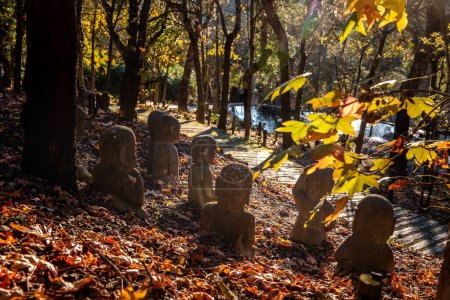 Landscape in Oriental Garden Bacalhoa Buddha Eden Park with Monk stone figures in Portugal