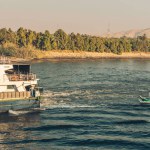 Nile river landscape with tourists tour boats, Travel Egypt Nile cruise