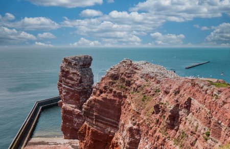 Long Anna, a famous red rock on the island Heligoland. North sea, Germany.