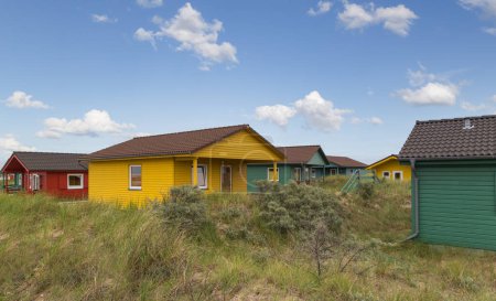 Beautiful and colorful wooden houses on the beach of the island Heligoland - Dune. North sea. Germany.