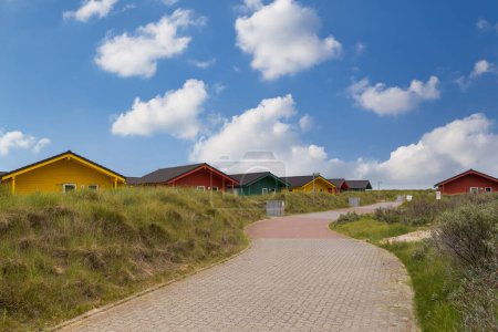 Beautiful and colorful wooden houses on the beach of the island Heligoland - Dune. North sea Germany.