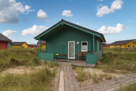 Beautiful and colorful wooden houses on the beach of the island Heligoland - Dune. North sea Germany.