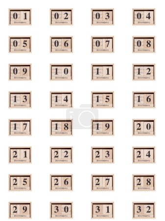 Foto de Calendario de madera, conjunto de fechas mes de noviembre 01-32, sobre un fondo blanco primer plano - Imagen libre de derechos