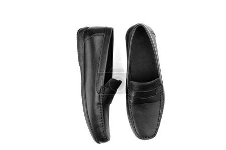 men's pair of black moccasins on isolated white background close-up