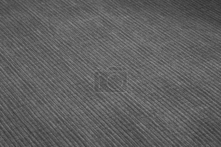 Textured corduroy furniture fabric in grey colors close-up