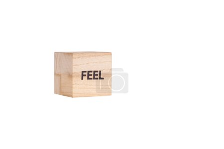 wooden cubes with the inscription Feel on a white isolated background close-up