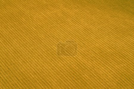 Tejido de muebles de pana texturizada en colores amarillos de cerca