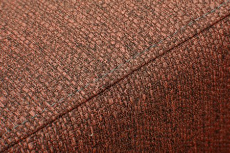 Photo for Textured brown furniture fabric with stitching close-up - Royalty Free Image
