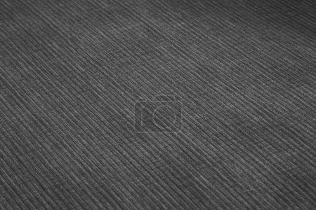 Textured corduroy furniture fabric in black colors close-up