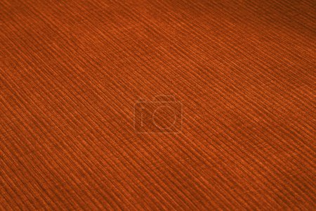 Tejido de muebles de pana texturizada en colores naranja de cerca