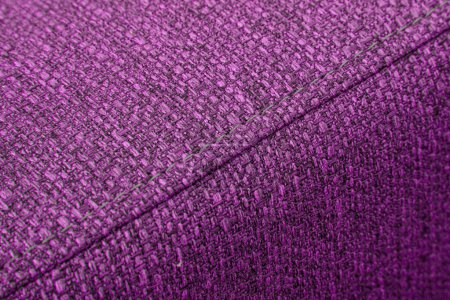 Texturé tissu de meubles rose avec coutures gros plan