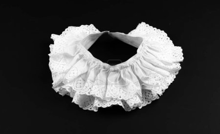 Foto de Vintage white collar with ruffles on black background - Imagen libre de derechos