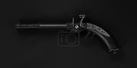 Photo for Pirate pistol isolated on black background - Royalty Free Image