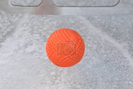 Foto de Orange ball for bandy on ice - Imagen libre de derechos