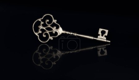 Photo for Ancient golden key isolated on black background - Royalty Free Image