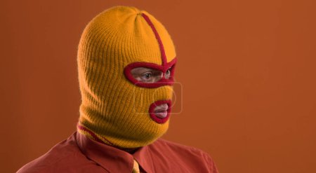 Photo for Portrait of a man in a yellow balaclava - Royalty Free Image