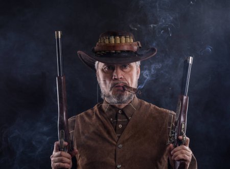 Photo for Wild West, cowboy with weapons - Royalty Free Image