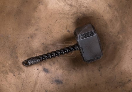 Thor's hammer on metal background