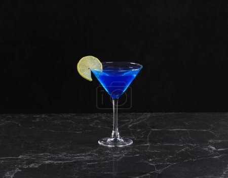 blue curacao cocktail on black background