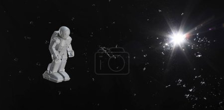 Spielzeug-Astronaut am schwarzen Himmel