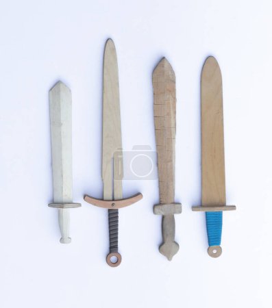 collection of wooden swords isolated on white background