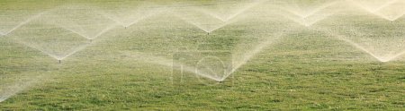 Foto de Automatic water irrigation system for lawn - Imagen libre de derechos