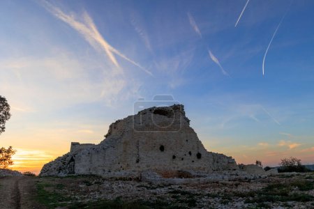 Photo for The walls of the castle ruins Kula Turnina near Rovij in Istria backlit at sunset - Royalty Free Image