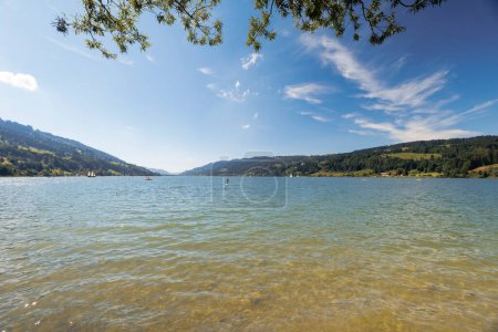 Foto de View over the Alpsee near Immenstadt to the opposite shore with mountains and forests - Imagen libre de derechos