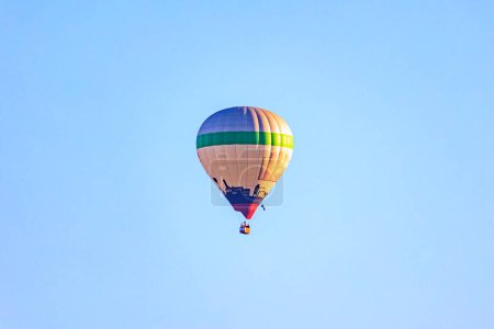 Photo for A colorful hot air balloon in the morning blue sky over the city of Augsburg - Royalty Free Image