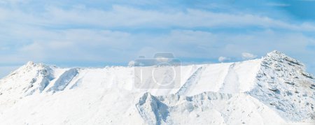 Photo for Sea salt piled up into a mountain of the salt production near the town of Aigues-Mortes in the Camarque region of France - Royalty Free Image