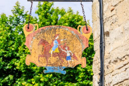 Photo for Old tin sign with a weathered painting of St. Martin in  old town of Aigues-Mortes in Camarque - Royalty Free Image