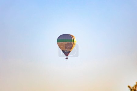 Photo for A colorful hot air balloon in the morning blue sky over the city of Augsburg - Royalty Free Image