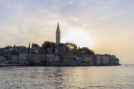 Photo for Tower of St. Euphemia Church in Rovinj on the peninsula with the picturesque old town in the light of the sunset - Royalty Free Image